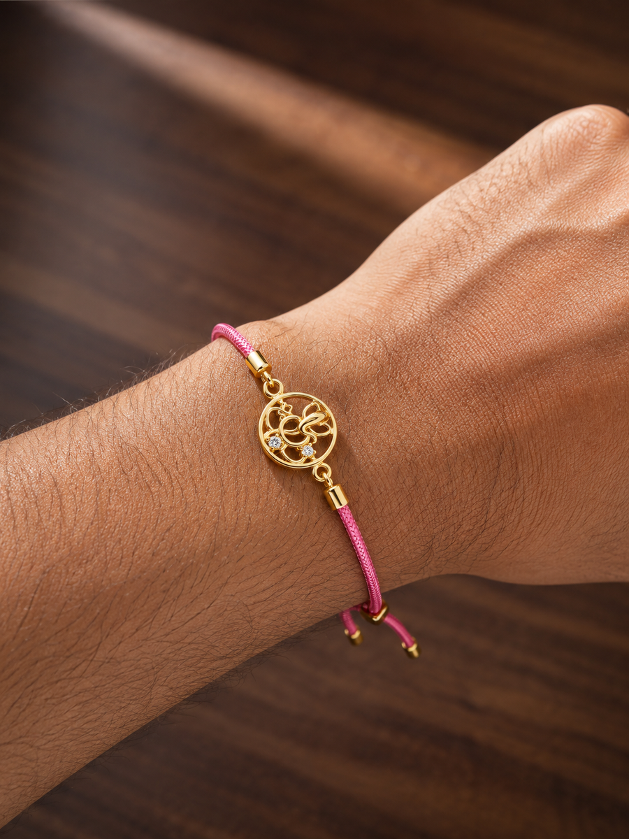 925 Sterling Silver Gold-Plated Ganesha Charm Rakhi with pink braided thread — alternate angle