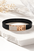Silvonar men's stretch-fit black link bracelet with rose gold crystal buckle, worn on wrist