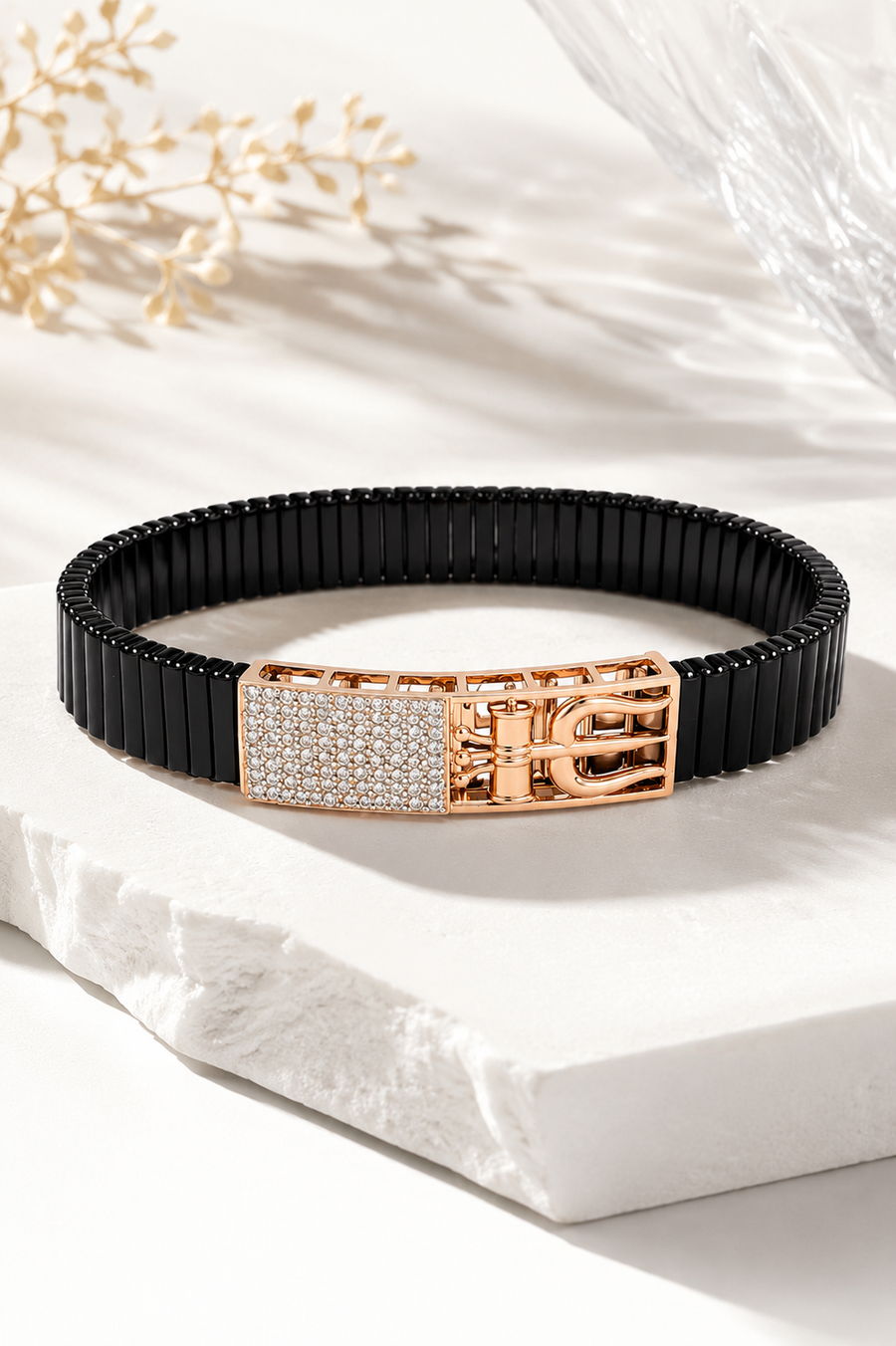 Silvonar men's stretch-fit black link bracelet with rose gold crystal buckle, worn on wrist